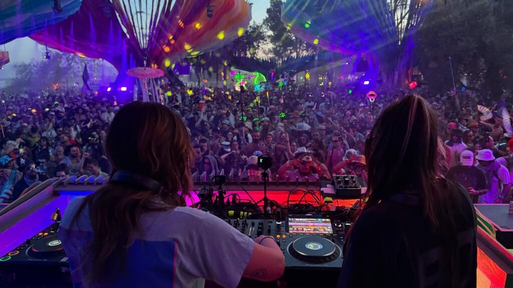 Two female DJs play for a big crowd at Lightning in a Bottle 2025.